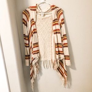 Fringe cardigan with stripes.
